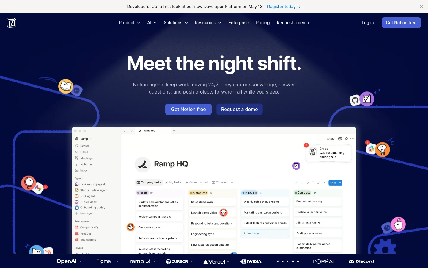 The Notion homepage features a dark blue background with large white text reading 'Meet the night shift.' and a subheadline about Notion agents. The layout includes a navigation bar with links like Product and AI, a 'Get Notion free' button, and a large central graphic showing a simplified software interface. Playful, colorful 3D icons of books and lightbulbs are scattered around the page.