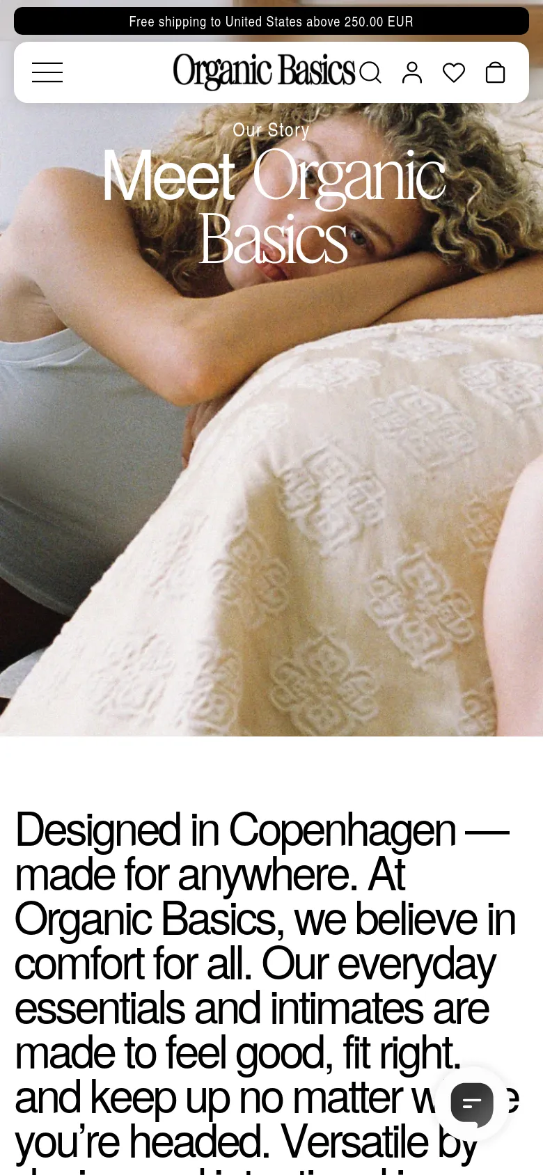The mobile version presents a vertically oriented hero image of the models, with the 'Meet Organic Basics' headline positioned centrally over the subjects. The top navigation is condensed into a hamburger menu, search icon, user profile, favorites, and shopping bag icons. The text content below the image is stacked vertically for easier scrolling on a narrow screen.