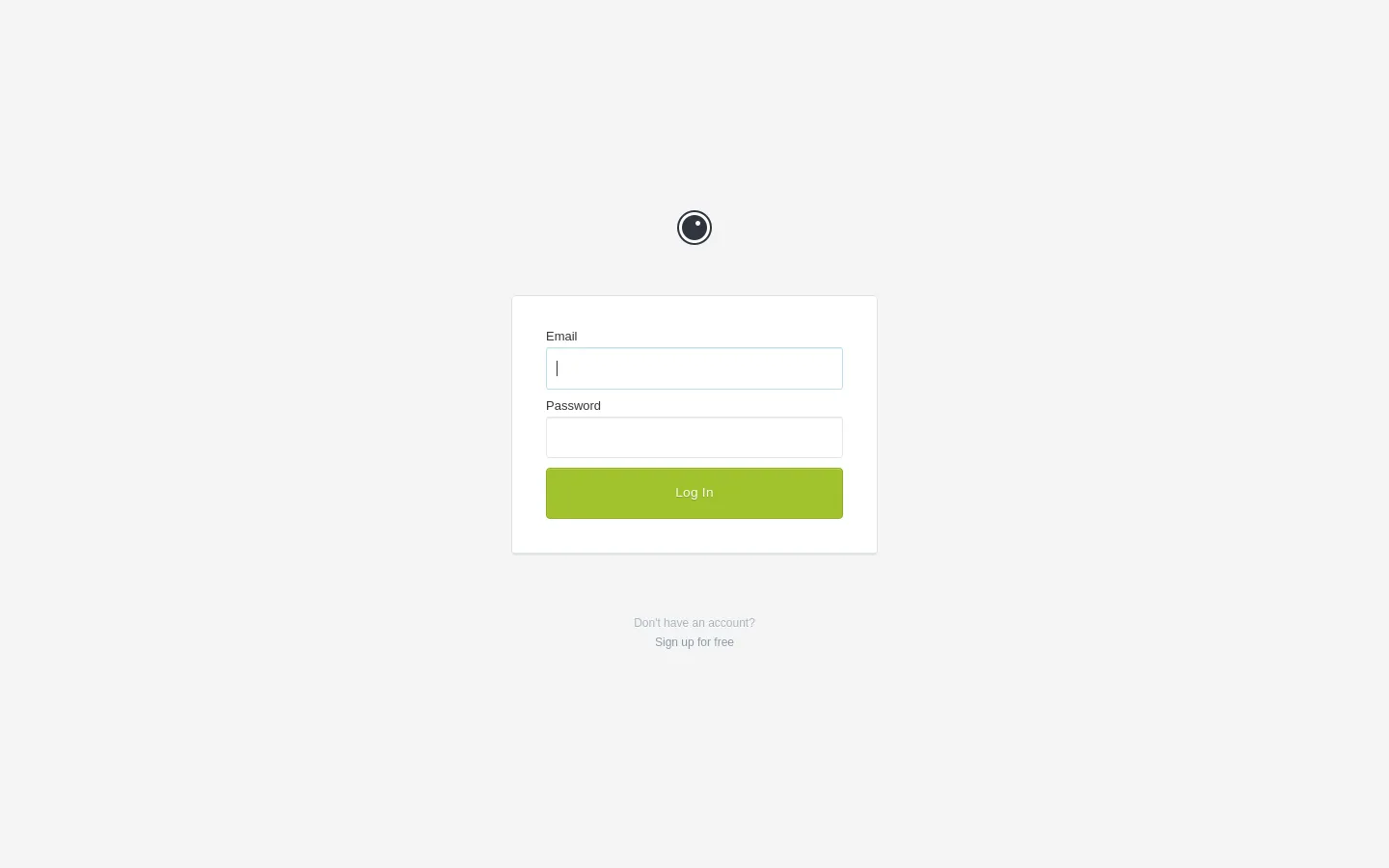 The desktop login page features a centered white login card on a light gray background. It contains a small circular logo at the top, input fields for Email and Password, and a prominent lime green 'Log In' button. Below the card, there is a text link that says 'Sign up for free'.