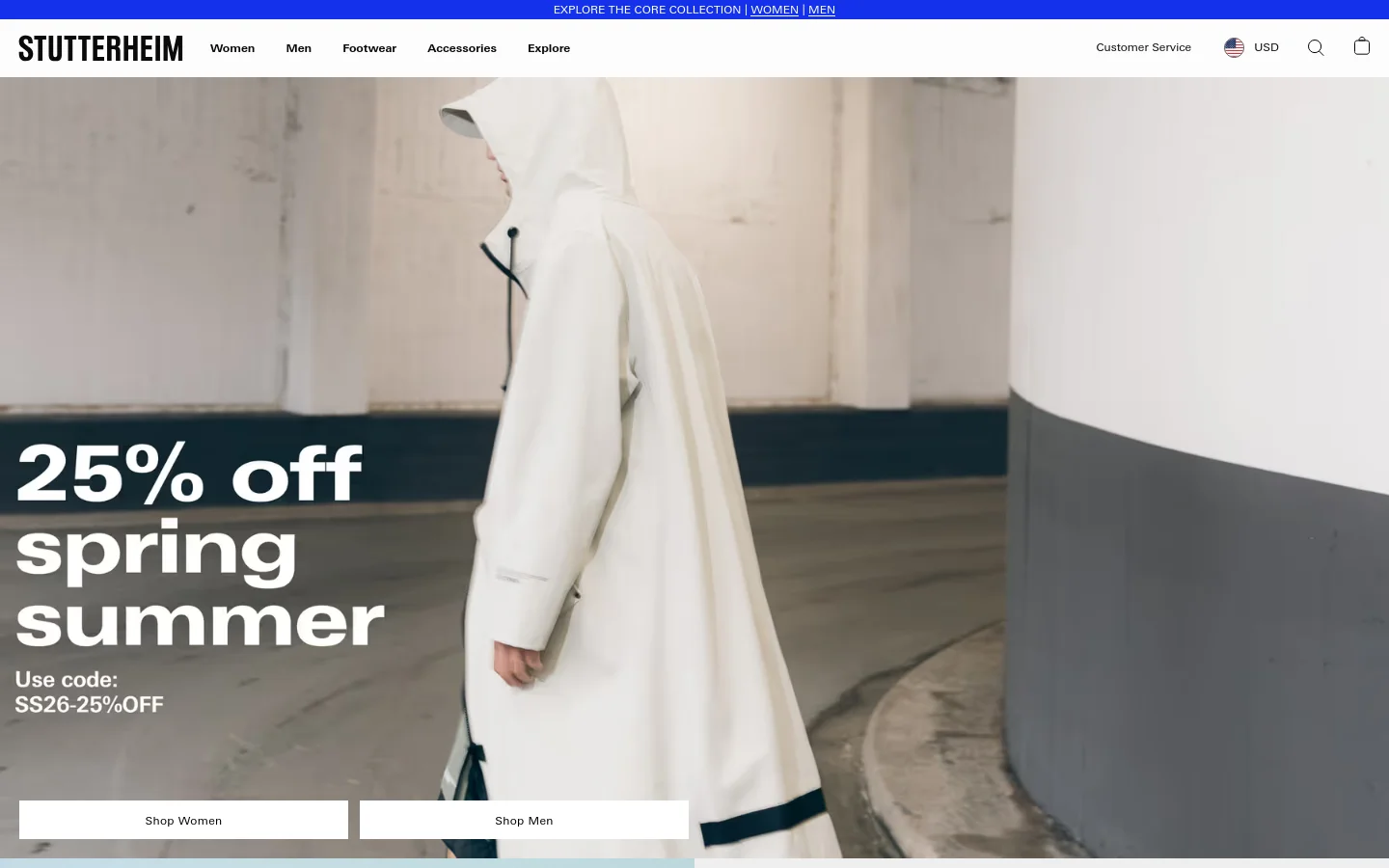 The desktop homepage features a large hero image of a person in a white raincoat against a minimalist concrete background, overlaid with the text '25% off spring summer' and 'Use code: SS26-25%OFF'. Two prominent call-to-action buttons, 'Shop Women' and 'Shop Men', sit at the bottom of the hero section. The navigation menu at the top includes links for Women, Men, Footwear, Accessories, and Explore, set against a clean white header.