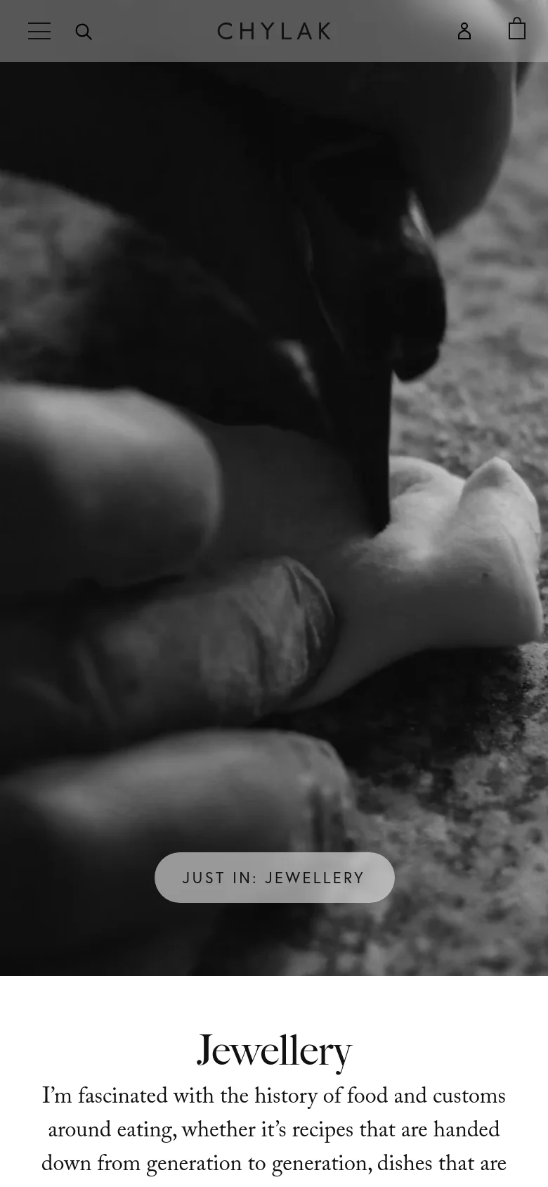 The mobile version presents a vertically oriented, close-up black and white hero image of hands preparing dough, with a 'JUST IN: JEWELLERY' call-to-action button overlaid near the bottom. The navigation is condensed into a simplified header with a menu icon, search icon, brand name, and user/bag icons, optimized for a narrow screen.
