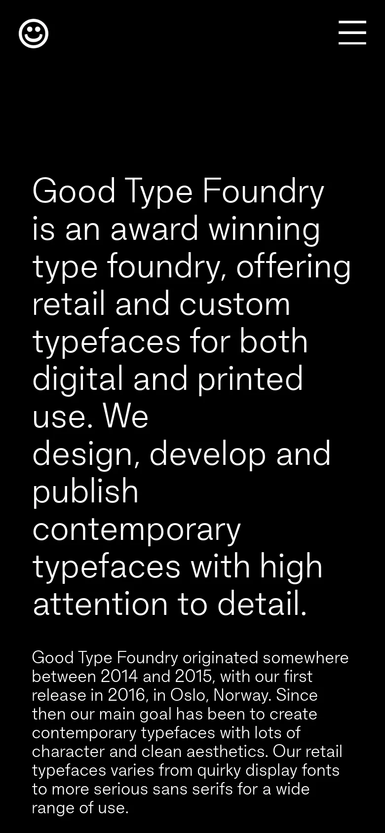 The mobile version maintains the black background and white text but uses a condensed single-column layout. The navigation is simplified into a hamburger menu icon and a smiley face logo at the top, with the large headline text scaling to fit the narrower screen width.