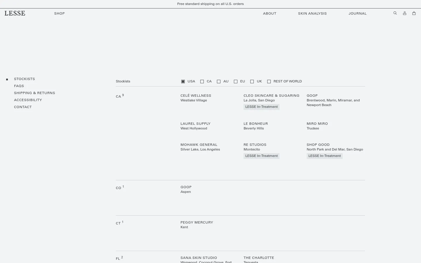 The desktop version of the Stockists page features a minimalist design with a white background and black text. A navigation menu is at the top, followed by a horizontal list of regional filters including USA, CA, AU, EU, UK, and Rest of World. Below, stockists are organized in a multi-column grid layout categorized by US state, listing store names, locations, and 'LESSE In-Treatment' labels.