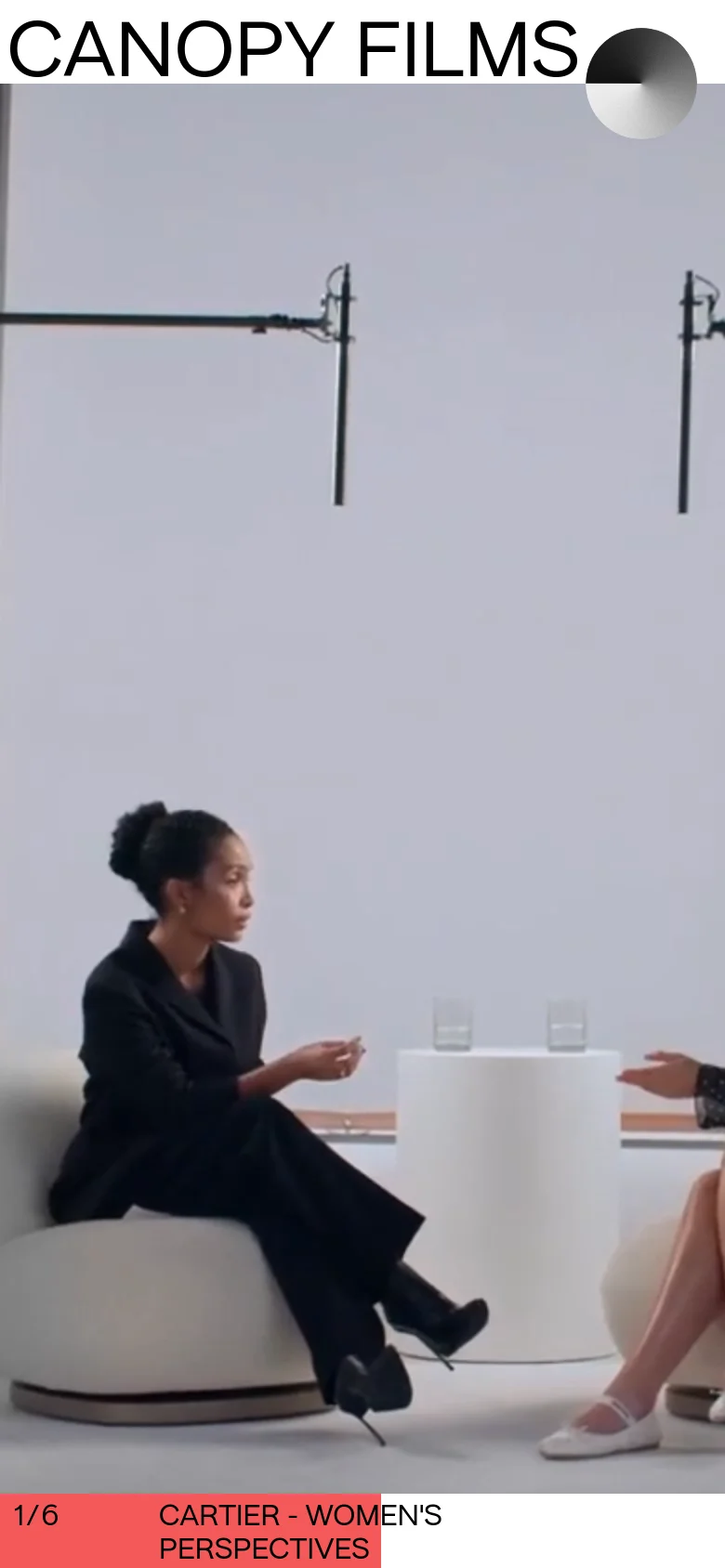 The mobile version simplifies the layout into a vertical stack, placing the 'CANOPY FILMS' title and navigation links at the top. The large video background occupies the center of the screen, and the project title 'CARTIER - WOMEN'S PERSPECTIVES' is displayed in a red bar at the bottom.