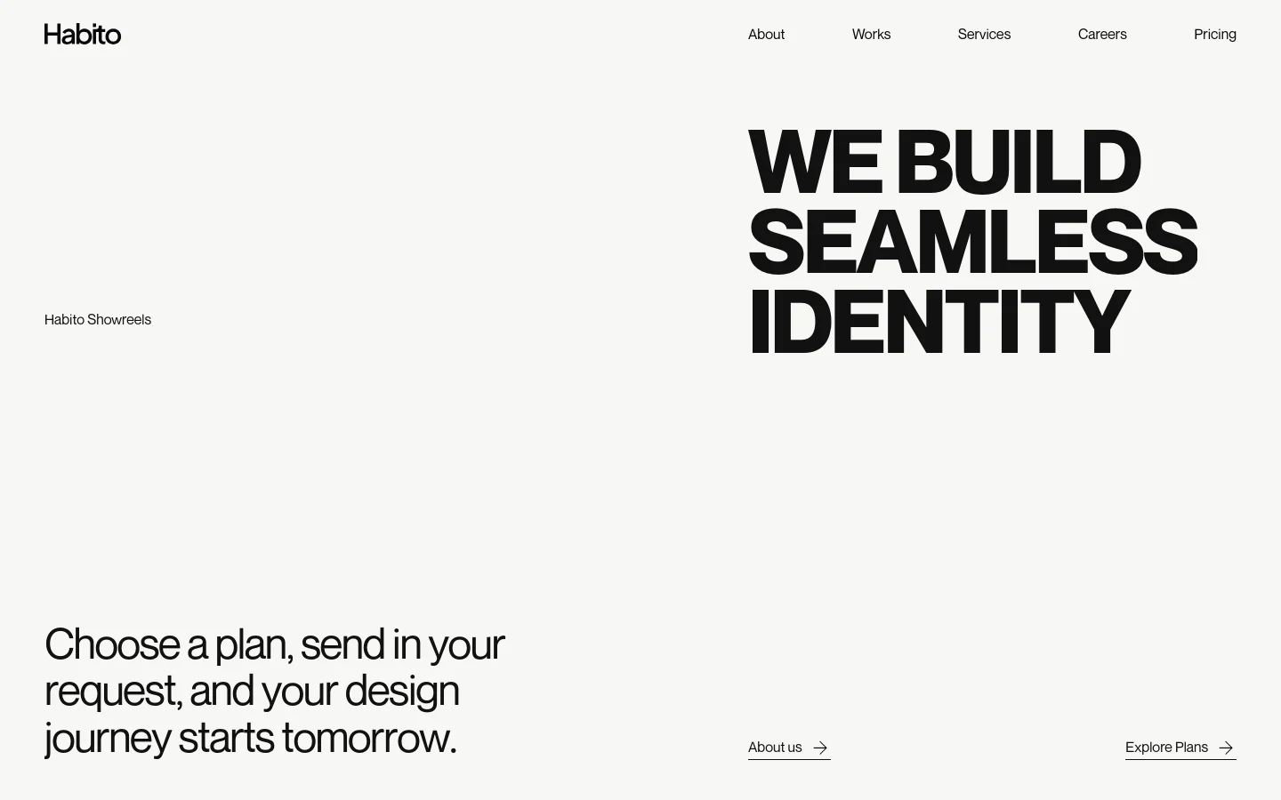 The desktop homepage features a minimalist white background with bold black typography. The hero section displays the headline 'WE BUILD SEAMLESS IDENTITY' in large capital letters, accompanied by a subheadline and two text links with arrows for 'About us' and 'Explore Plans'. A navigation menu is located at the top right, and a video link for 'Habito Showreels' is positioned on the left.
