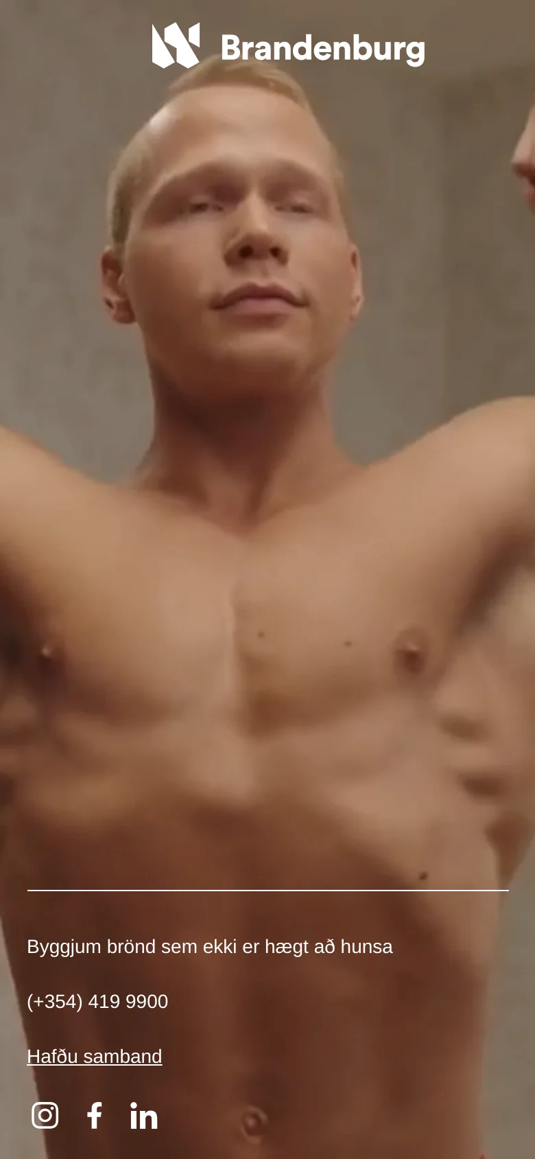 The mobile version displays a vertical, full-screen portrait of a man's torso as the hero image. The Brandenburg logo is positioned at the top, while the slogan, phone number, contact link, and social media icons (Instagram, Facebook, LinkedIn) are stacked vertically at the bottom.