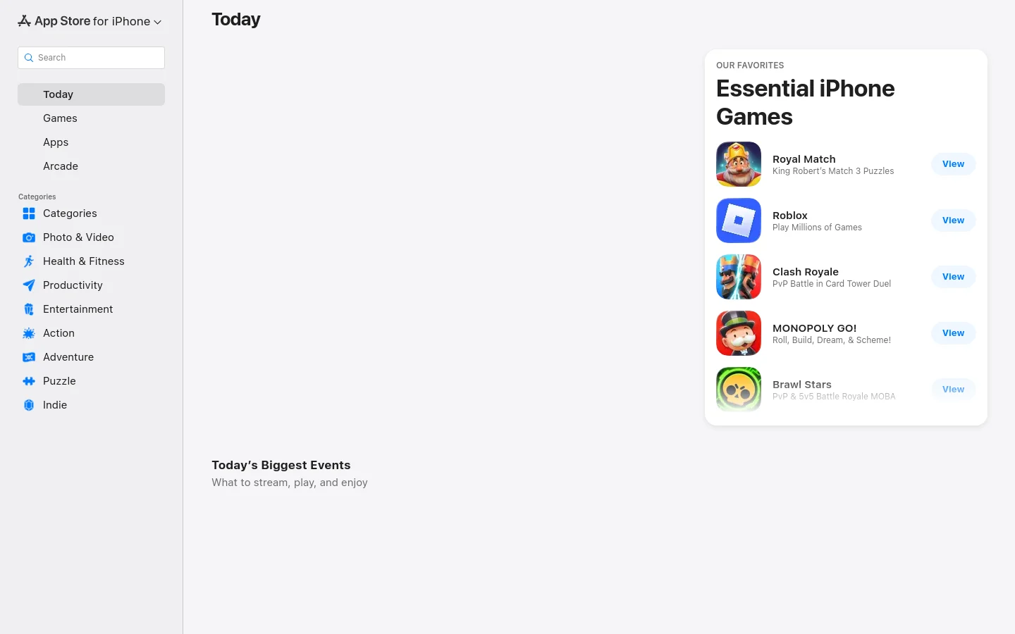 The App Store desktop homepage features a white background with a left-hand sidebar for navigation, including search and categories like Games and Apps. The main content area displays a 'Today' heading and a prominent 'Our Favorites' card titled 'Essential iPhone Games' featuring a list of apps like Royal Match and Roblox with blue 'View' buttons.