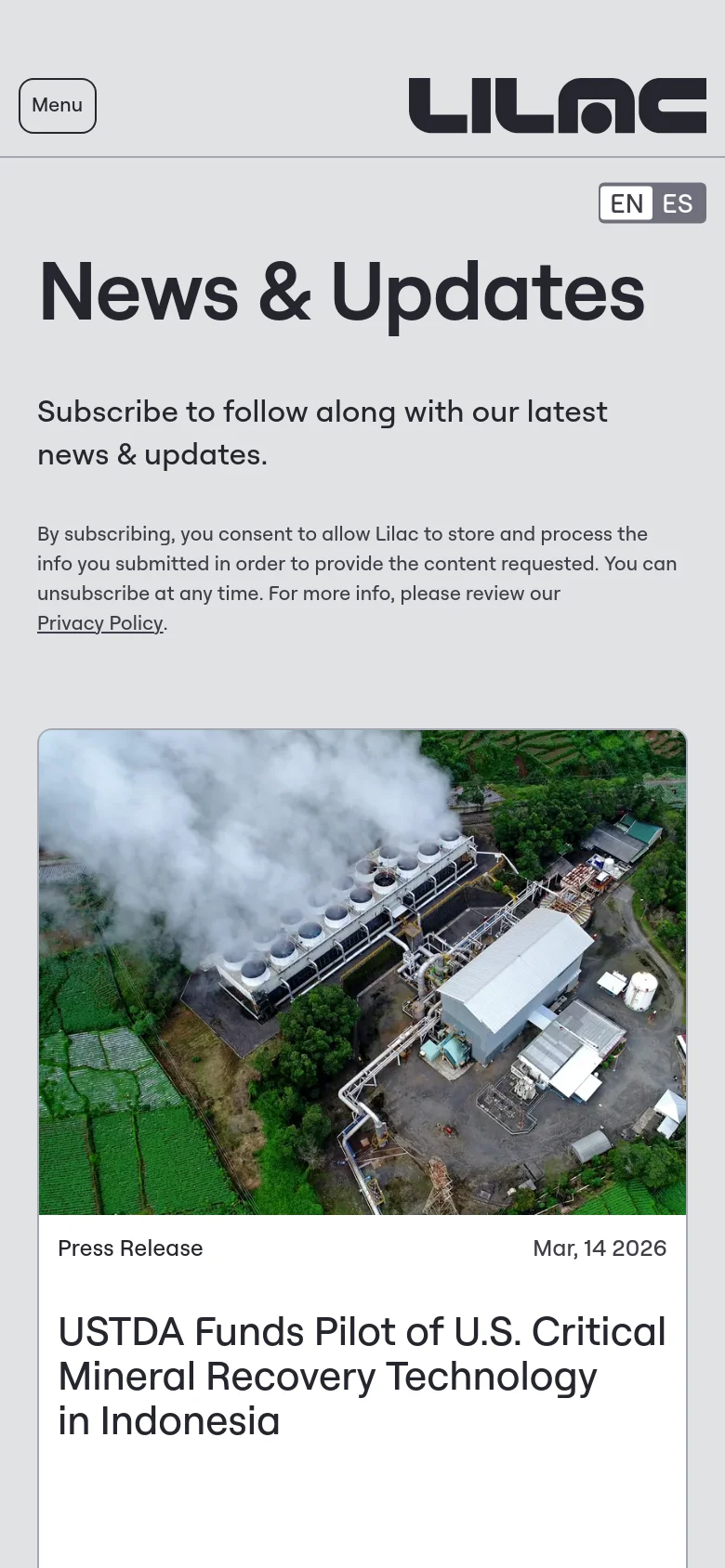 The mobile version presents a vertically stacked layout on a light gray background. The 'News & Updates' headline and subscription prompt appear at the top, followed by a privacy policy disclaimer. The featured news article follows, showing the industrial facility image above its corresponding headline and date.