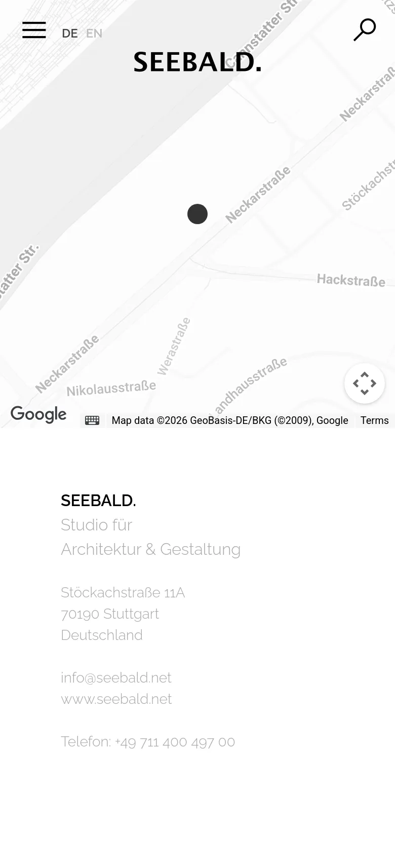 The mobile version simplifies the layout by moving the navigation menu into a hamburger icon at the top left. The Google Map occupies the top half of the screen, while the studio's address, email, and phone number are stacked vertically in the bottom half. The overall aesthetic remains minimalist with a focus on readability.