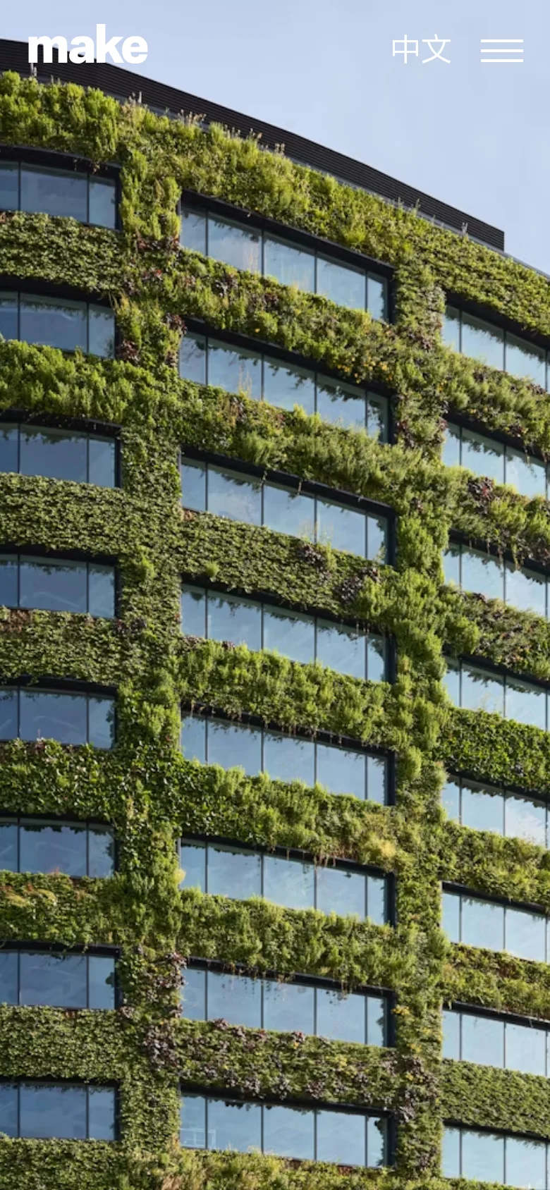 The mobile version displays a full-width hero image of a building facade covered in dense green vegetation between rows of windows. The 'make' logo is at the top left, with a language selector and a hamburger menu icon on the top right. The layout is vertically oriented to emphasize the scale of the green architecture.