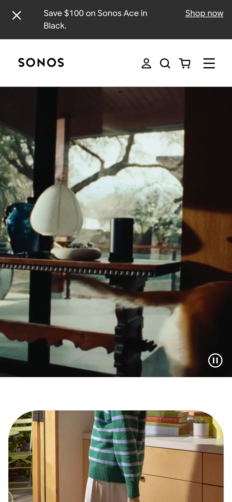 The mobile version presents a streamlined vertical layout with a condensed header featuring a hamburger menu, search, cart, and user icons. The hero video remains prominent at the top, while the promotional banner at the very top is optimized for a smaller screen width.