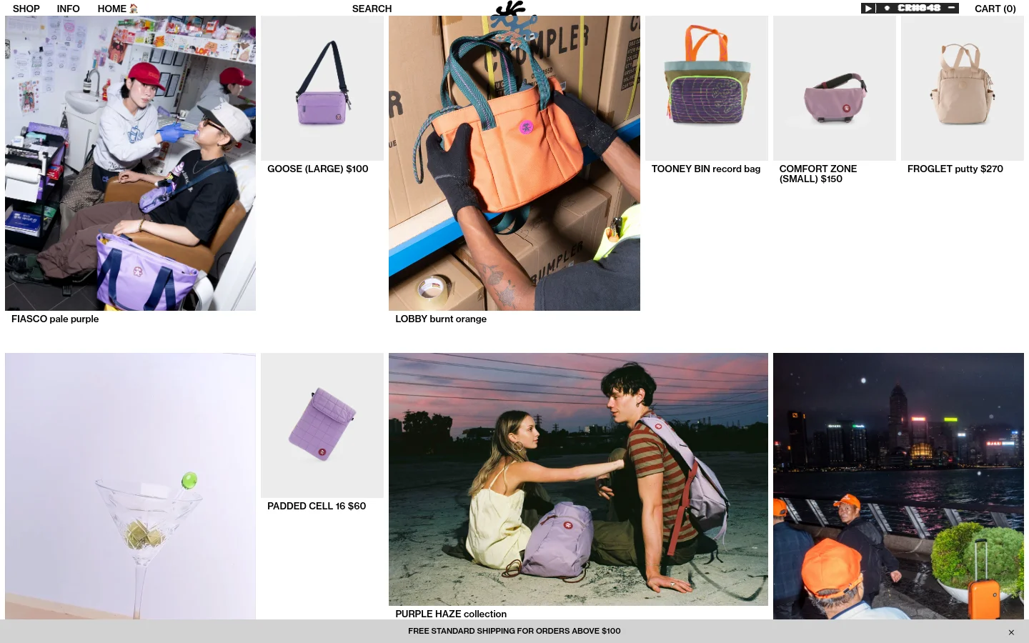 The Crumpler homepage features a grid layout of colorful bags and lifestyle photography against a clean white background. A large hero image shows two people in a studio setting, followed by product tiles for various bags like the Goose, Lobby, and Tooney Bin, each with a name and price. The navigation menu is at the top with links for Shop, Info, Home, and Search.