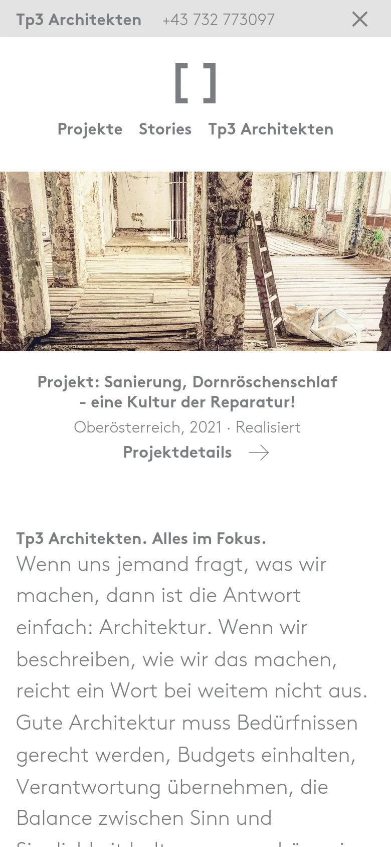 The mobile version presents a vertically stacked layout with a smaller header containing a close icon and contact number. The hero image of the building interior is scaled down, followed by the project title, description, and a prominent 'Projektdetails' call to action with an arrow, leading into a text section about the firm's philosophy.