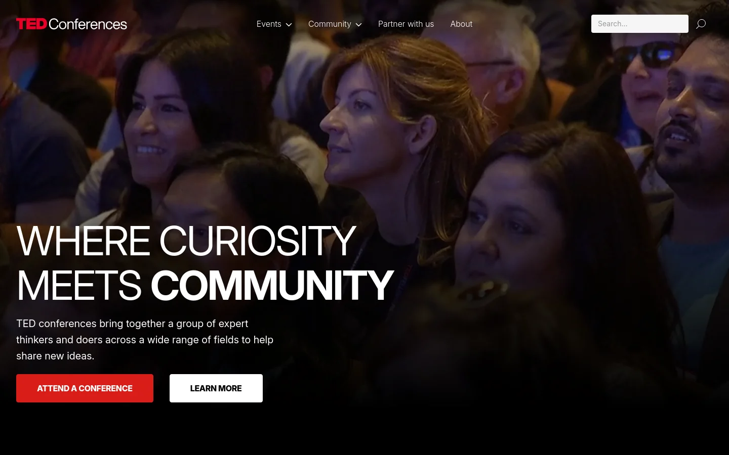 The desktop homepage features a large hero image of a diverse crowd of people, overlaid with the headline 'WHERE CURIOSITY MEETS COMMUNITY' in bold white text. Below the text are two primary call-to-action buttons: a red 'ATTEND A CONFERENCE' button and a white 'LEARN MORE' button. The navigation bar at the top includes the TED Conferences logo, menu links for Events, Community, Partner with us, and About, and a search bar.