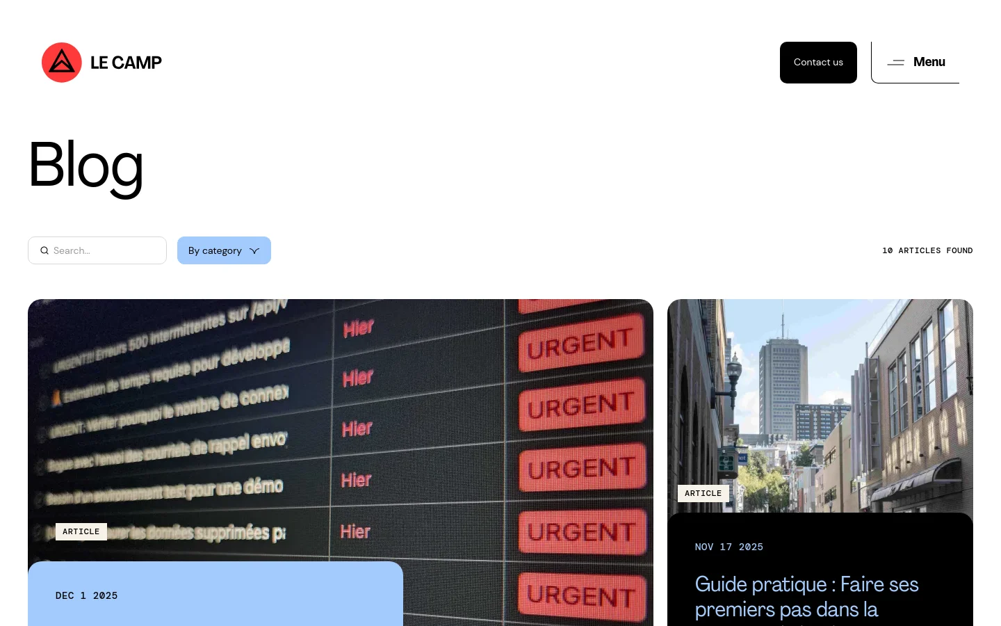 The desktop blog page features a clean white background with a large 'Blog' heading and a search bar alongside a category dropdown menu. Below, blog posts are arranged in a grid layout, each displaying a large featured image, a category label, the date, a bold headline, and a 'See more' link. The design uses a minimalist aesthetic with high-contrast black text and subtle gray accents.