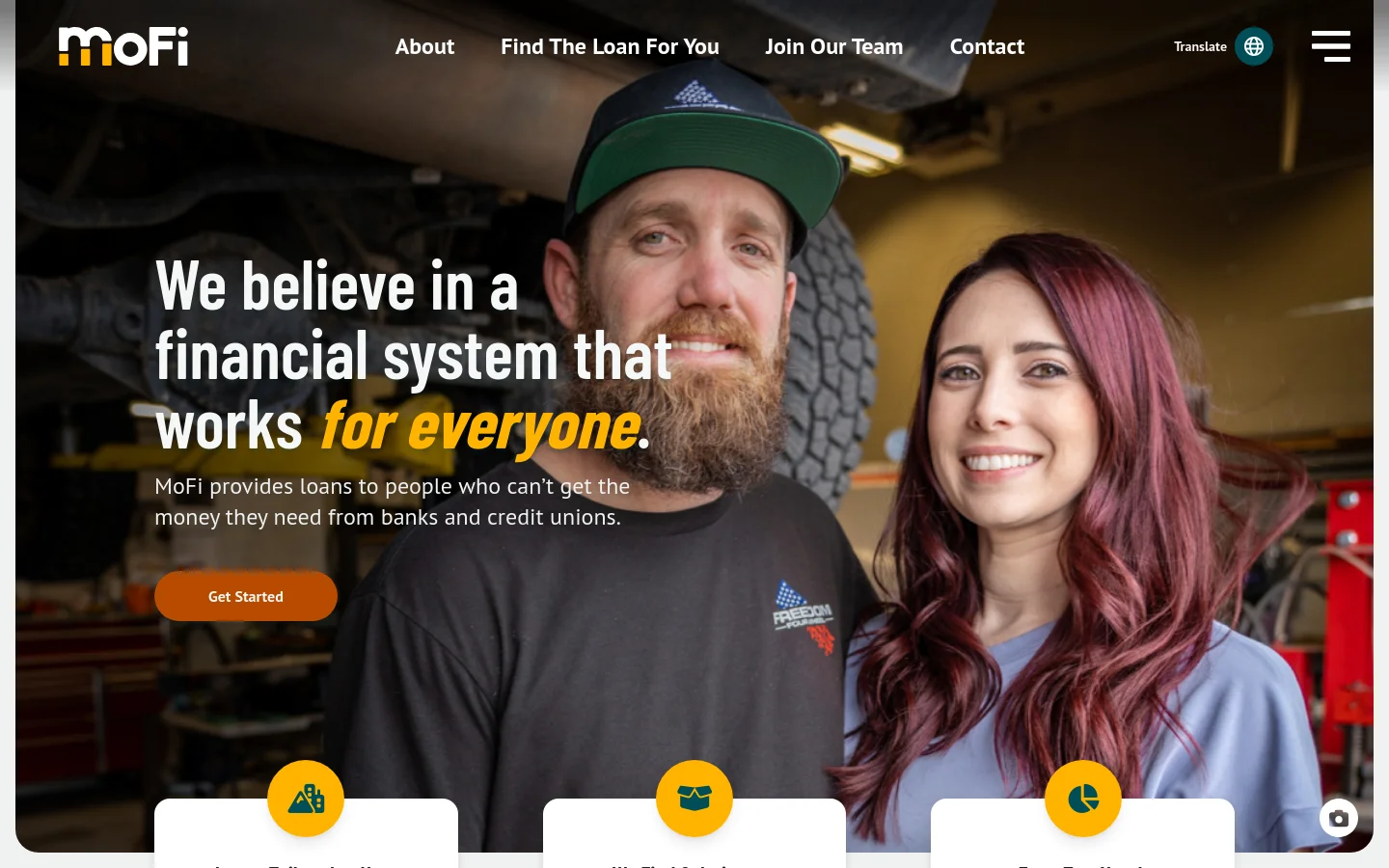 The MoFi homepage features a large hero image of a smiling man and woman in a workshop setting with a dark overlay. A prominent headline reads 'We believe in a financial system that works for everyone' next to an orange 'Get Started' button. The navigation bar at the top includes links for About, Find The Loan For You, Join Our Team, and Contact.