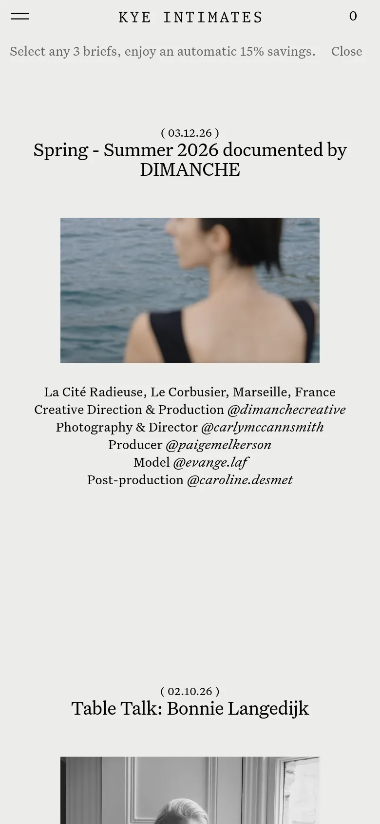 The mobile version maintains the minimalist aesthetic but uses a single-column vertical layout optimized for scrolling. The navigation is condensed into a hamburger menu icon on the left, with the brand name 'KYE INTIMATES' centered and a shopping cart icon on the right. Headlines and images are scaled to fit the narrower screen width.