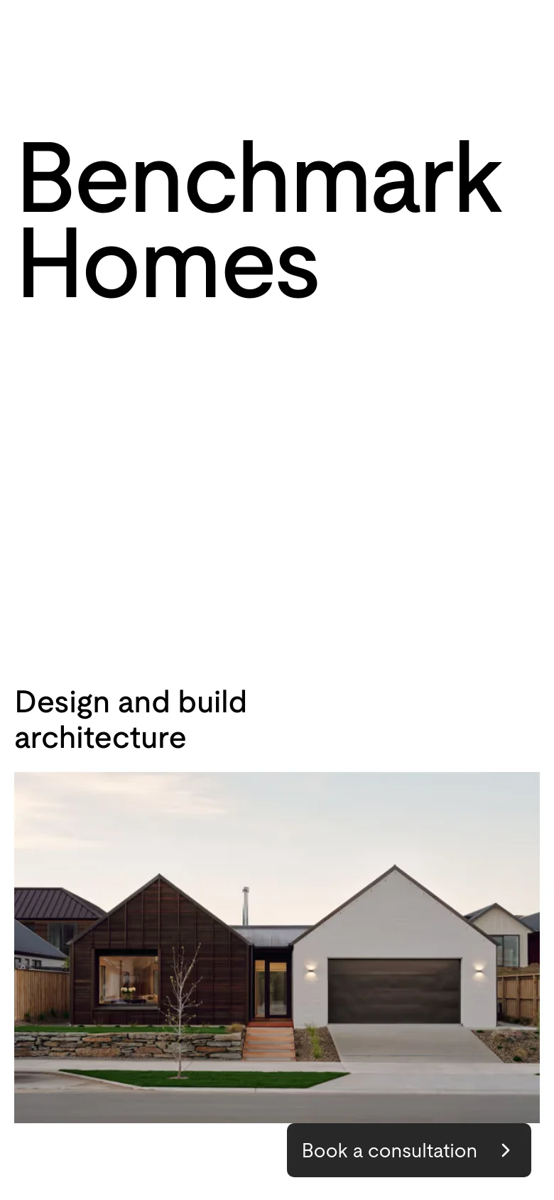 The mobile version maintains the minimalist aesthetic with large black text on a white background. The layout is vertically stacked, placing the 'Benchmark Homes' title and 'Design and build architecture' text above a full-width hero image of a modern house, with the 'Book a consultation' button anchored at the bottom.