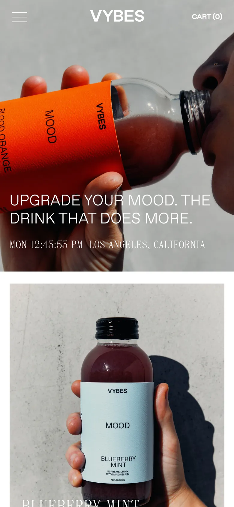 The mobile version presents a vertically oriented hero image of the same person drinking the beverage, with the headline and time/location text centered below the bottle. The layout is streamlined for a single column, and the navigation menu is simplified with a hamburger icon on the left and the cart on the right.
