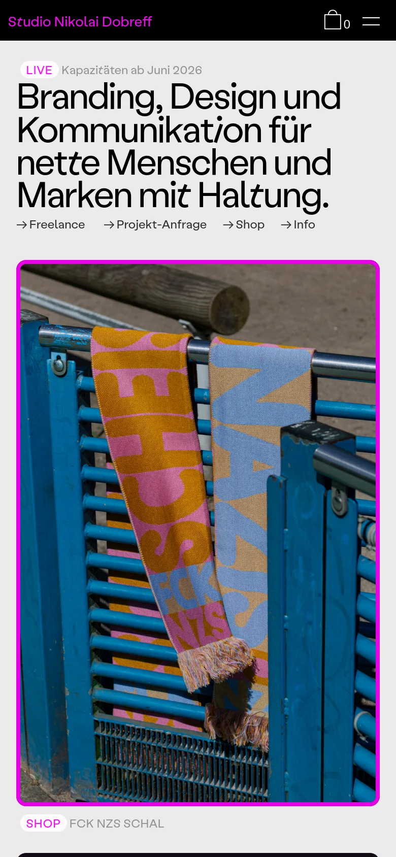 The mobile version maintains the minimalist aesthetic but stacks elements vertically for a narrow viewport. The headline and navigation links are centered, and the large hero image of the patterned scarf occupies the full width of the screen below the text.