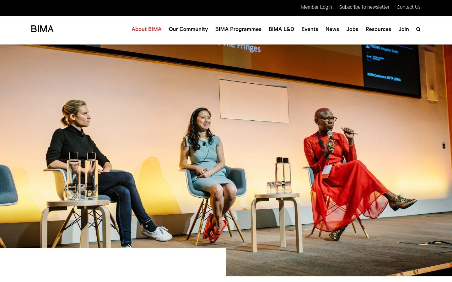 The desktop page features a white header with the BIMA logo and a horizontal navigation menu including links like 'About BIMA' and 'Join'. Below the header, a large hero image shows three women seated on stage during a panel discussion titled 'Innovation At The Fringes'. A dark sub-header contains utility links for Member Login and Contact Us, followed by the 'Our Mission' section with red and grey text.