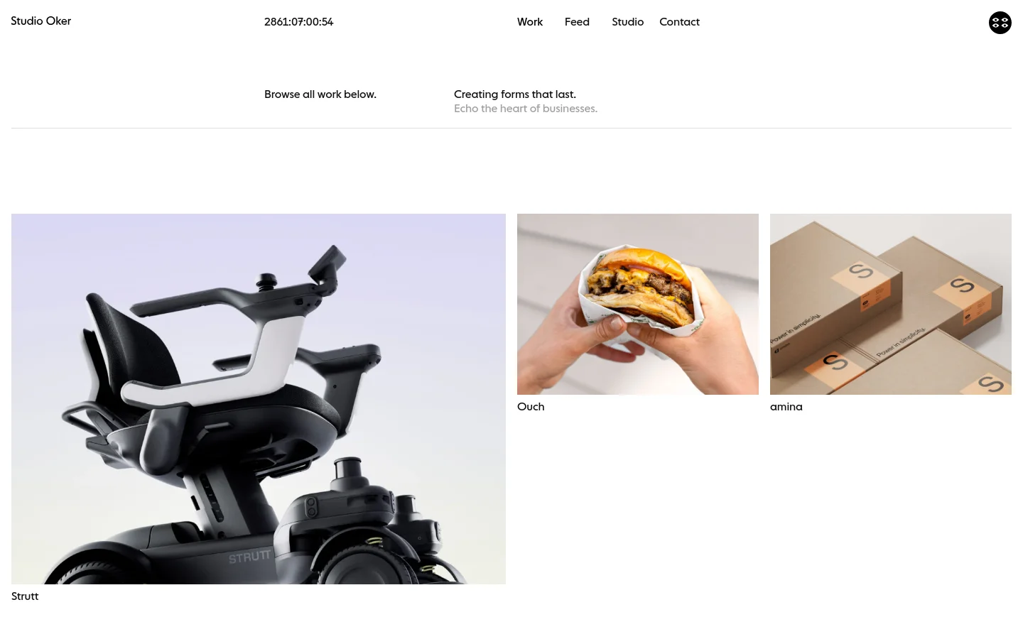 The Work page of Studio Oker features a minimalist white layout with a navigation menu at the top. A grid of large project images displays various works like Strutt, Ouch, and amina, each accompanied by a title and a short descriptive tagline. The design uses clean typography and ample whitespace to showcase high-quality photography.