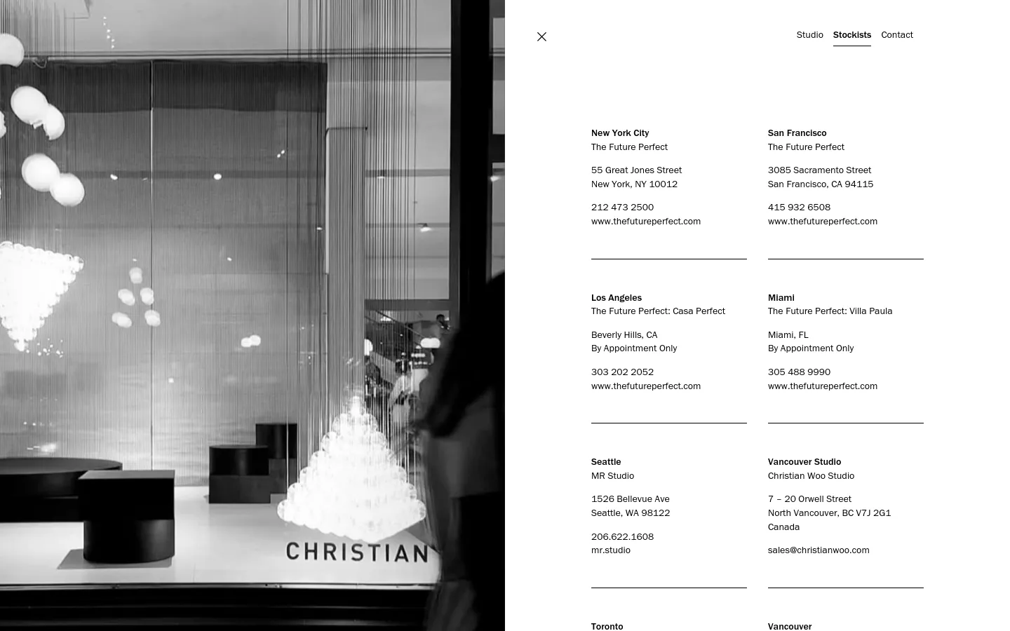A minimalist desktop page with a large, black and white hero image on the left showing a blurred interior with hanging light fixtures. On the right, a clean white background displays stockist locations including New York City, San Francisco, Los Angeles, Miami, Seattle, and Vancouver Studio, organized in a two-column grid with simple black text and horizontal dividers.