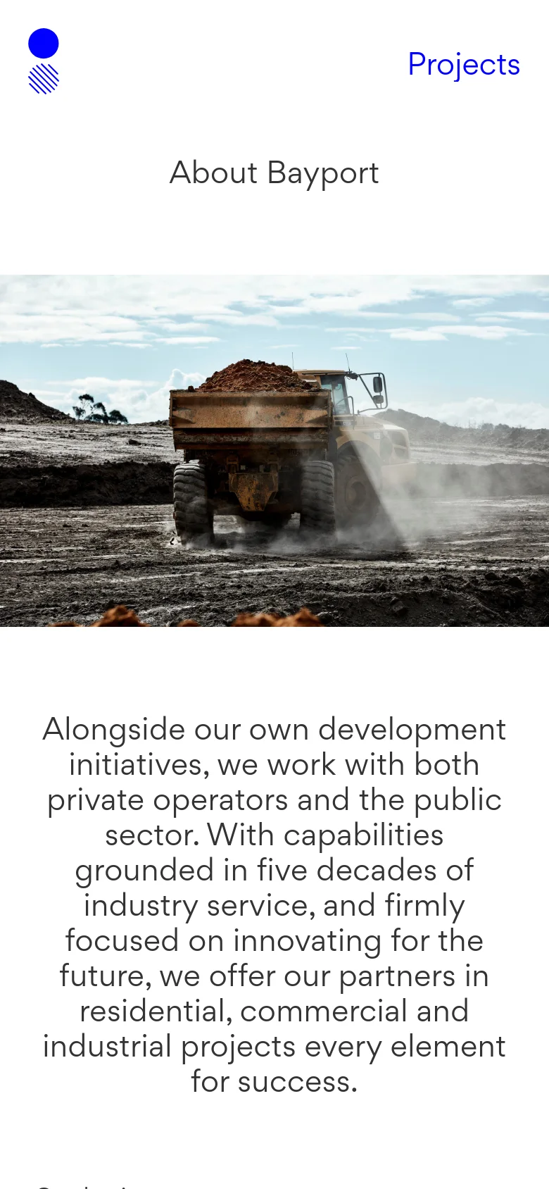 The mobile version maintains the same minimalist design, featuring the logo, 'Projects' link, and 'About Bayport' headline. The large hero image of the construction truck is scaled down to fit the vertical screen, followed by a block of descriptive text about the company's development initiatives.
