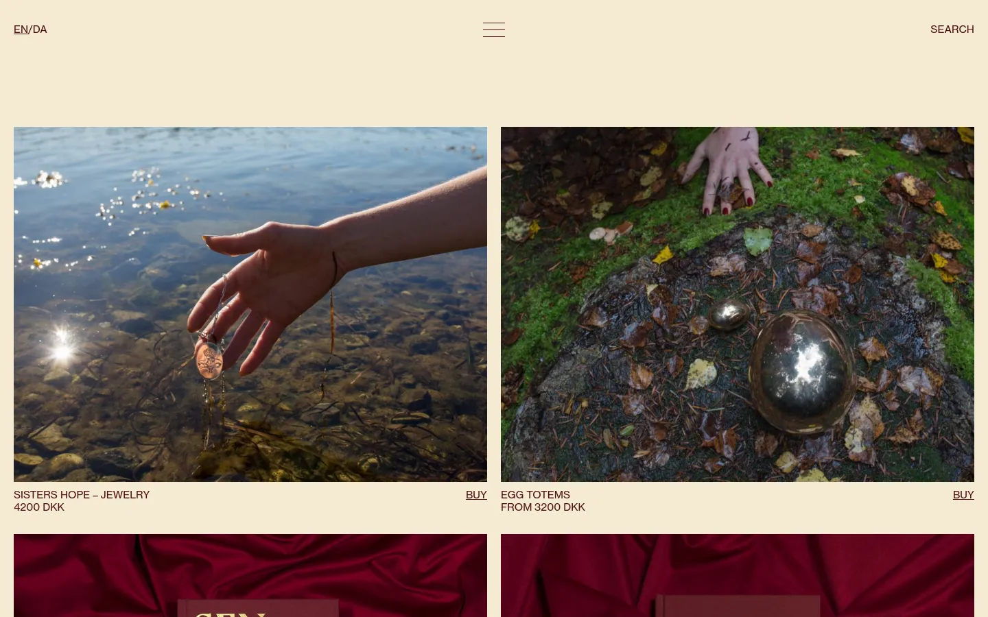 The desktop shop page features a minimalist cream background with a grid of large, high-quality product images. Each product entry includes a descriptive headline, price in DKK, and a 'BUY' call to action link. The layout is spacious, showcasing items like jewelry and totems through evocative lifestyle photography.