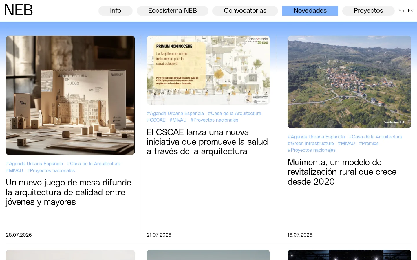 The desktop news page features a clean white background with a top navigation bar containing links like Info, Ecosistema NEB, and Novedades. The main content is a grid of news articles, each consisting of a large rectangular image, blue category hashtags, a bold black headline, and a publication date. The layout is spacious with a professional, minimalist aesthetic.