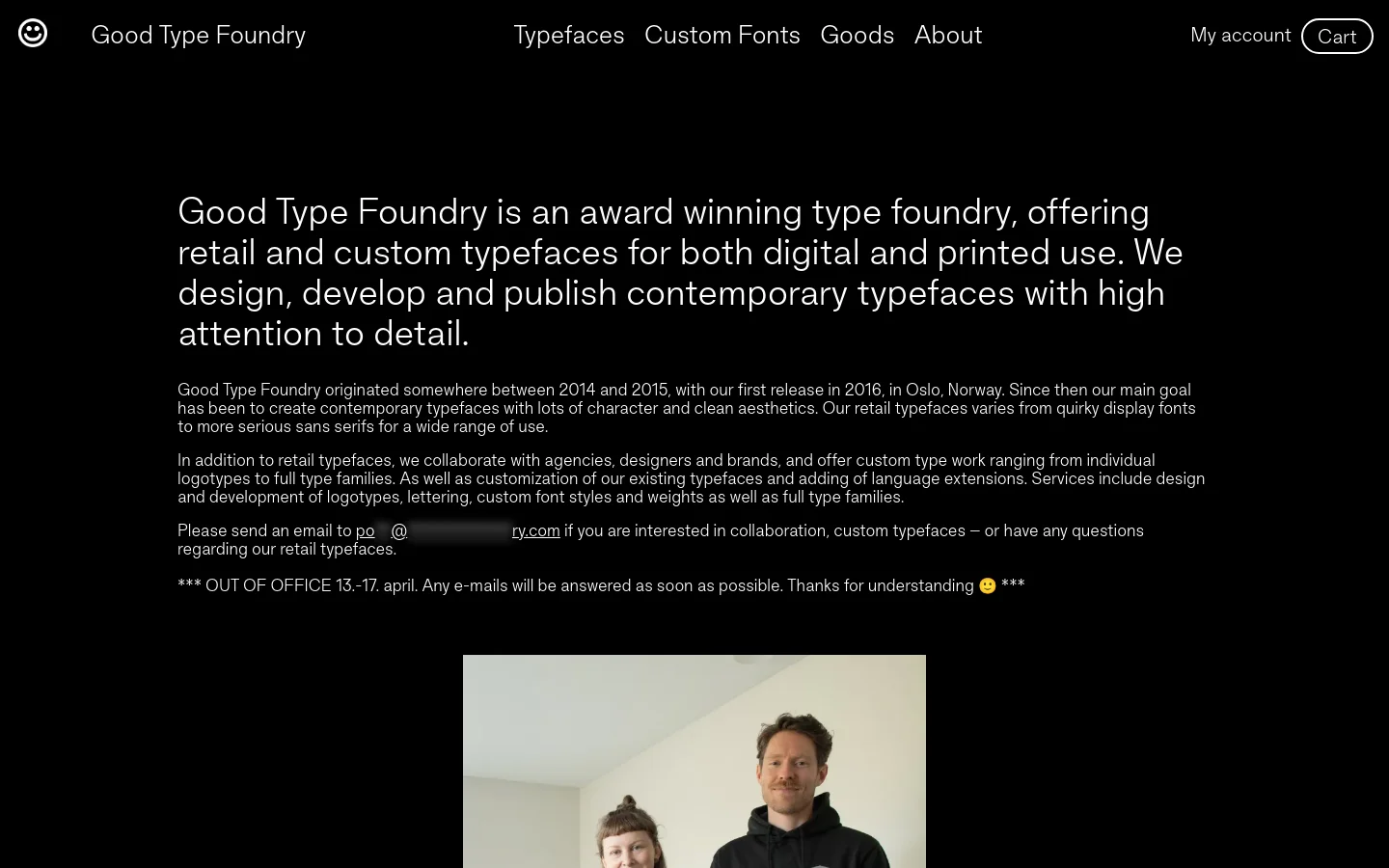 The desktop About page features a minimalist black background with large, white sans-serif typography. The layout consists of a navigation bar at the top, followed by a prominent headline and several paragraphs of text, ending with a vertical portrait of two people at the bottom. The design is clean and high-contrast, focusing heavily on typography.