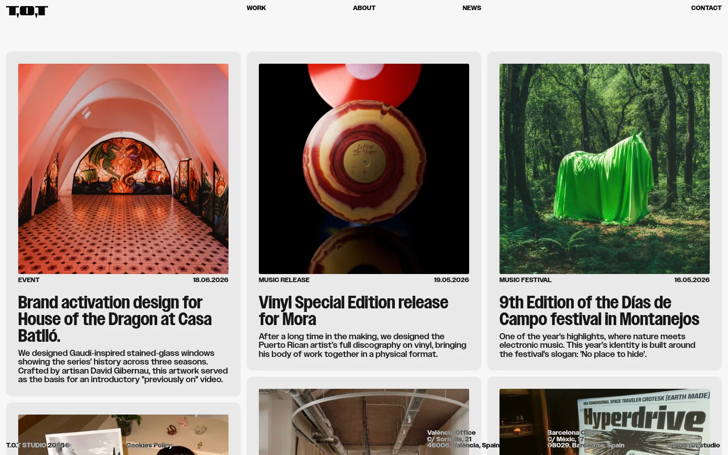 The News page features a minimalist white layout with a grid of large, colorful project cards. Each card contains a high-quality image, a category label, a date, a bold headline, and a short descriptive paragraph. The navigation menu at the top includes links for Work, About, News, and Contact.