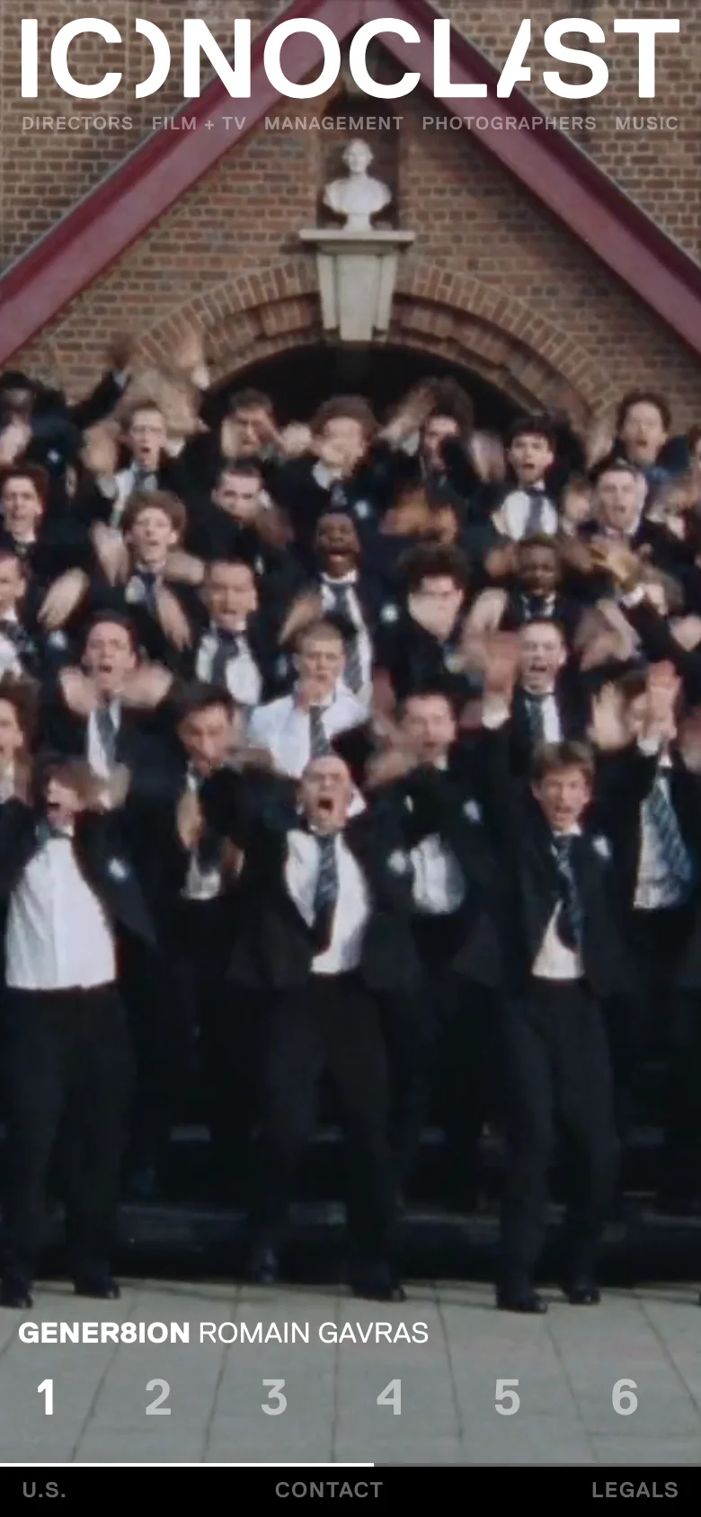 The mobile version uses a vertical layout with a condensed navigation menu at the top and bottom. The hero image of a crowd in suits remains the central focus, with the text 'GENER8ION ROMAIN GAVRAS' and the numbered slider positioned below the main visual on a dark overlay.