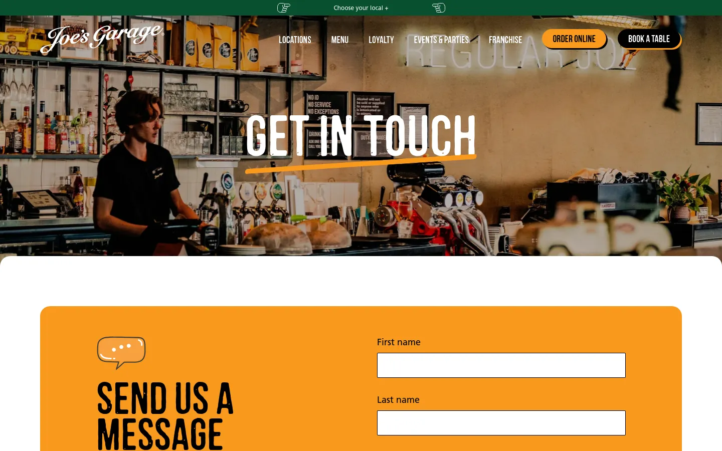 The desktop page features a wide hero image of a barista working behind a cafe counter with the large white text 'GET IN TOUCH' overlaid. Below the hero, a bright orange section contains a contact form titled 'SEND US A MESSAGE' with input fields for name and message. The navigation bar at the top is dark with white text and includes buttons for 'ORDER ONLINE' and 'BOOK A TABLE'.