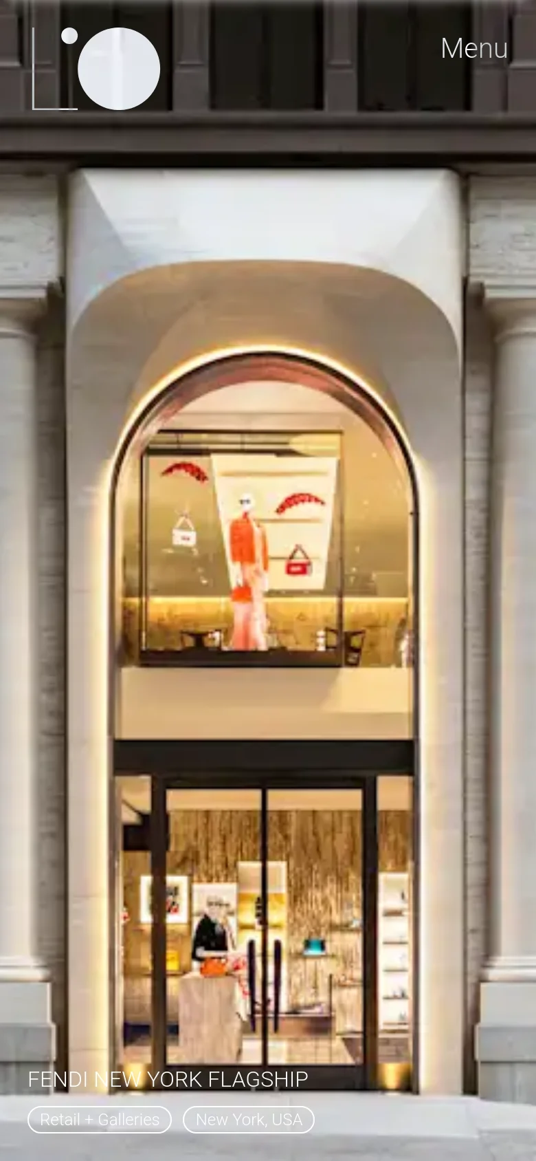 The mobile version displays a vertically oriented, full-screen hero image of a lit storefront archway. The navigation is simplified with the logo and 'Menu' text positioned at the top, and project information like 'Fendi New York Flagship' is anchored at the bottom of the screen.