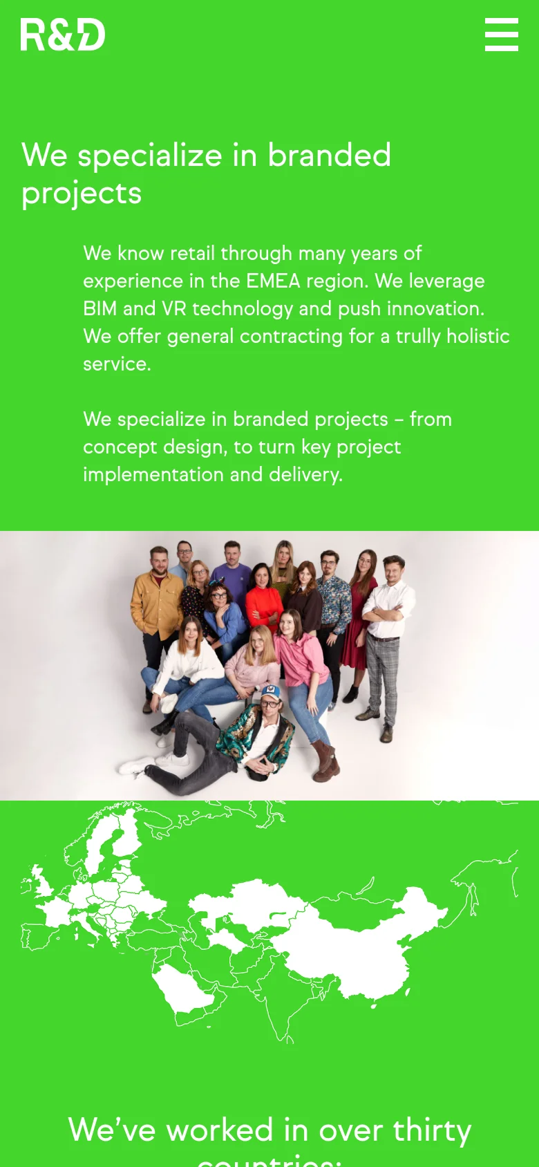 The mobile version uses a vertical layout with a large green hero section containing the headline and descriptive text. The team group photo is centered below the text, and the navigation is condensed into a hamburger menu icon in the top right corner.