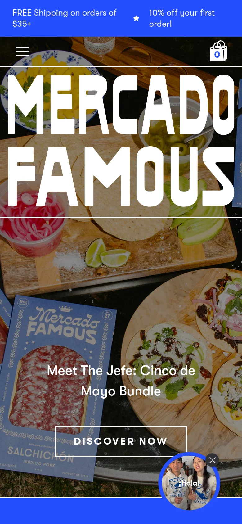 The mobile version uses a vertically oriented layout with the same food-themed hero image and white 'MERCADO FAMOUS' branding. The top navigation is condensed into a hamburger menu, and the promotional text 'Meet The Jefe: Cinco de Mayo Bundle' is centered over the image above a 'DISCOVER NOW' button. A small circular chat icon appears in the bottom right corner.