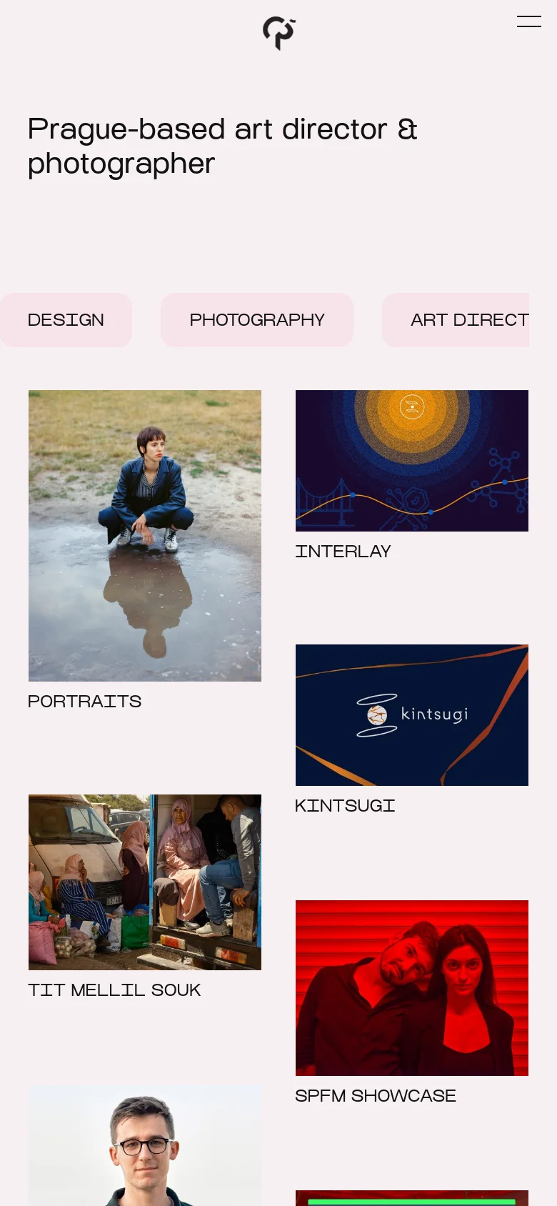 The mobile version maintains the light pink background and central logo but uses a simplified layout. The navigation menu is condensed into a hamburger icon, and the category tags and portfolio grid are stacked vertically to fit the narrow screen width.