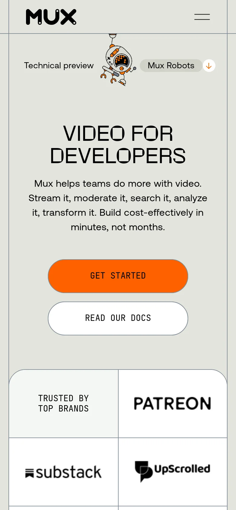 The mobile version uses a single-column layout with a simplified navigation menu and a centered hero section. The headline 'VIDEO FOR DEVELOPERS' is prominent, followed by the descriptive text and two large, stacked call-to-action buttons. The 'TRUSTED BY TOP BRANDS' section transitions from a horizontal row to a vertical grid of logos.