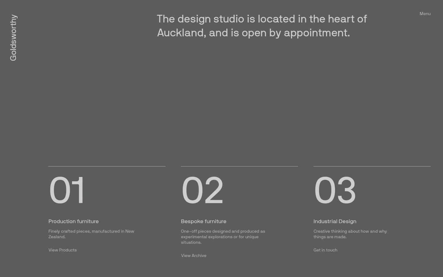 The desktop page features a minimalist dark grey background with white text. A large hero statement about the studio's Auckland location is at the top, followed by three numbered sections (01, 02, 03) arranged horizontally, each describing a service like Production furniture or Industrial Design with a corresponding call to action link.