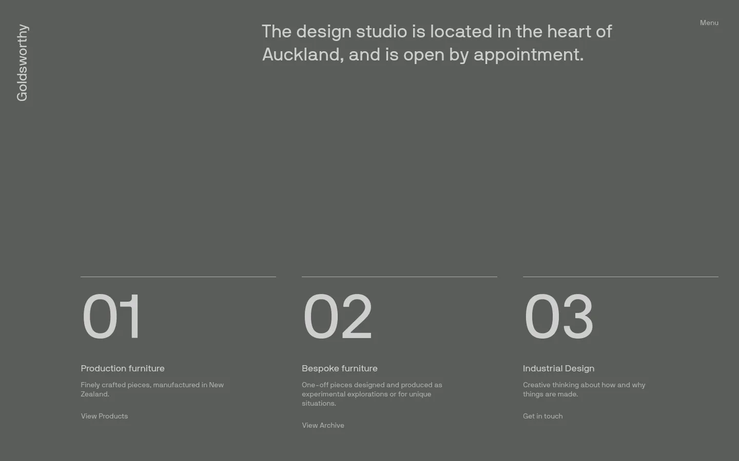 The desktop page features a minimalist dark grey background with white text. A large hero statement about the studio's Auckland location is at the top, followed by three numbered sections (01, 02, 03) arranged horizontally, each describing a service like Production furniture or Industrial Design with a corresponding call to action link.