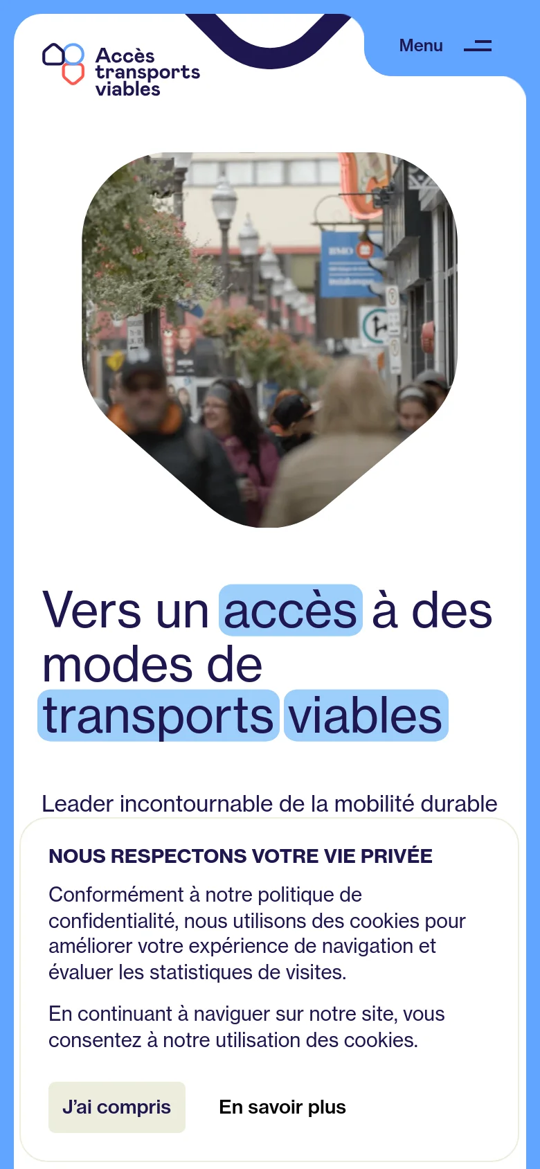 The mobile version presents a vertically stacked layout with the logo and menu at the top, followed by the large city street image. The main headline and introductory text appear below the image, and a prominent cookie consent banner covers the bottom portion of the screen. The desktop's side-by-side text and image layout is converted into a single-column scrolling format.