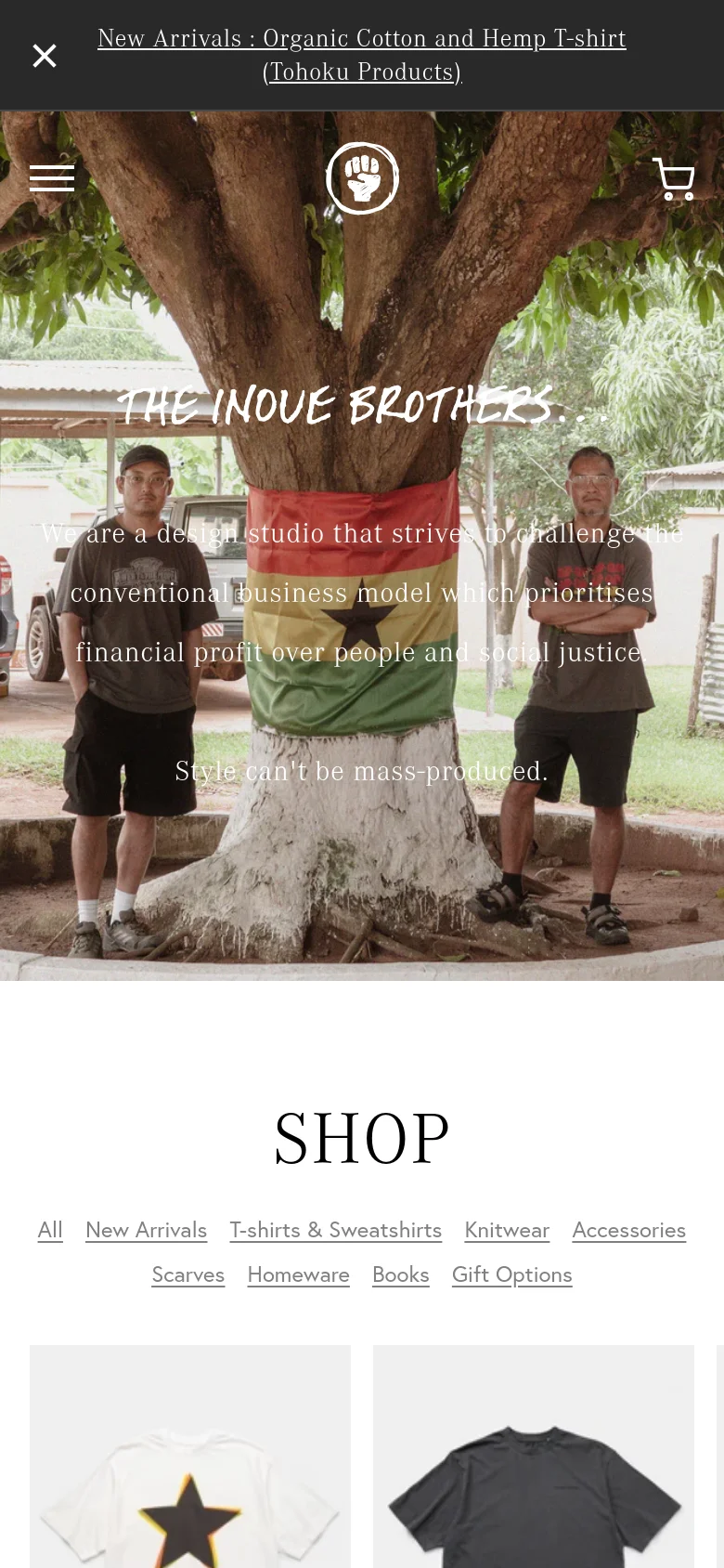 The mobile version presents a vertically stacked layout, starting with a dark announcement bar and a hero image of the two men by the tree. The brand name and mission statement are centered over the image, with a simplified header containing a hamburger menu, a central fist logo, and a shopping cart icon. The 'SHOP' section follows below, featuring a horizontally scrollable list of product categories.