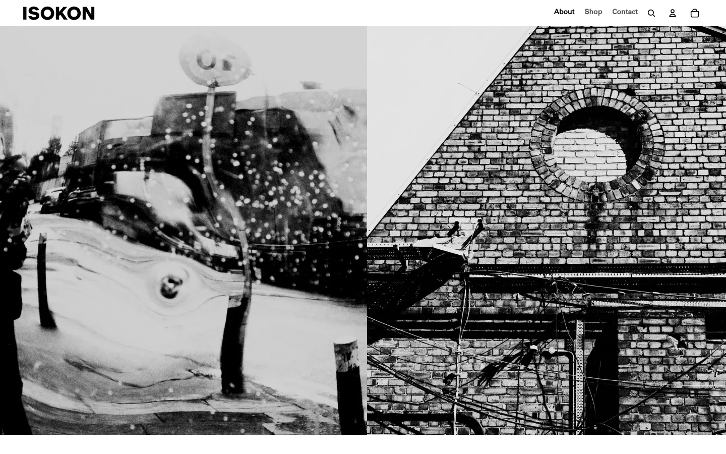 The desktop homepage features a minimalist design with a large black and white hero image split into two sections: an abstract street scene and a brick building with a circular window. Below the hero image, the Isokon logo is centered above a high-quality photograph of a light-colored plywood chair. The layout uses ample white space and clean typography, with a top navigation bar containing links for About, Shop, Contact, a search icon, a user profile icon, and a shopping bag.