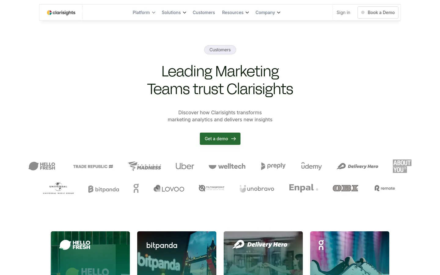The desktop page features a clean, white background with a centered headline reading 'Leading Marketing Teams trust Clarisights' and a subheadline about transforming marketing analytics. A dark green 'Get a demo' call-to-action button sits below the text, followed by a wide grid of grayscale customer logos including Uber, HelloFresh, and Delivery Hero. The navigation bar at the top includes links for Platform, Solutions, Customers, Resources, and Company, alongside a 'Book a Demo' button.