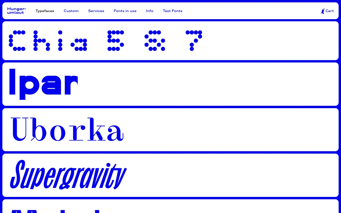 The desktop page for Hungarumlaut Type Foundry displays a minimalist white background with a blue navigation bar at the top. A vertical list of large, blue typeface specimens, including Chia, Ipar, Uborka, and Supergravity, each contained within a blue-outlined rectangular box, serves as clickable links to individual font pages.