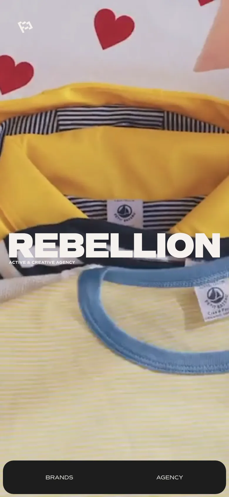 The mobile version displays a vertically oriented close-up shot of yellow and striped clothing as the hero background, with the same bold white 'REBELLION' branding. A dark navigation bar containing 'BRANDS' and 'AGENCY' links is anchored at the bottom of the screen.