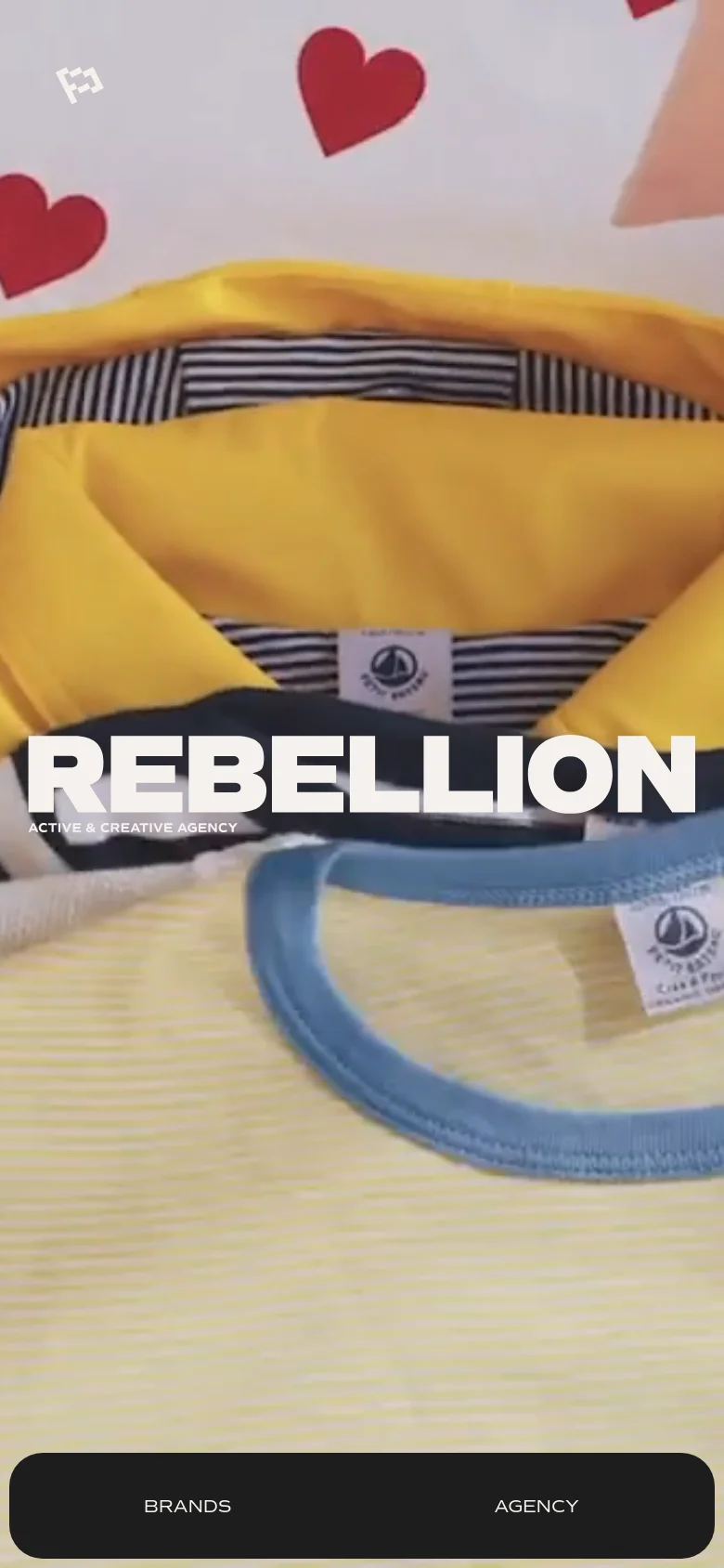 The mobile version displays a vertically oriented close-up shot of yellow and striped clothing as the hero background, with the same bold white 'REBELLION' branding. A dark navigation bar containing 'BRANDS' and 'AGENCY' links is anchored at the bottom of the screen.