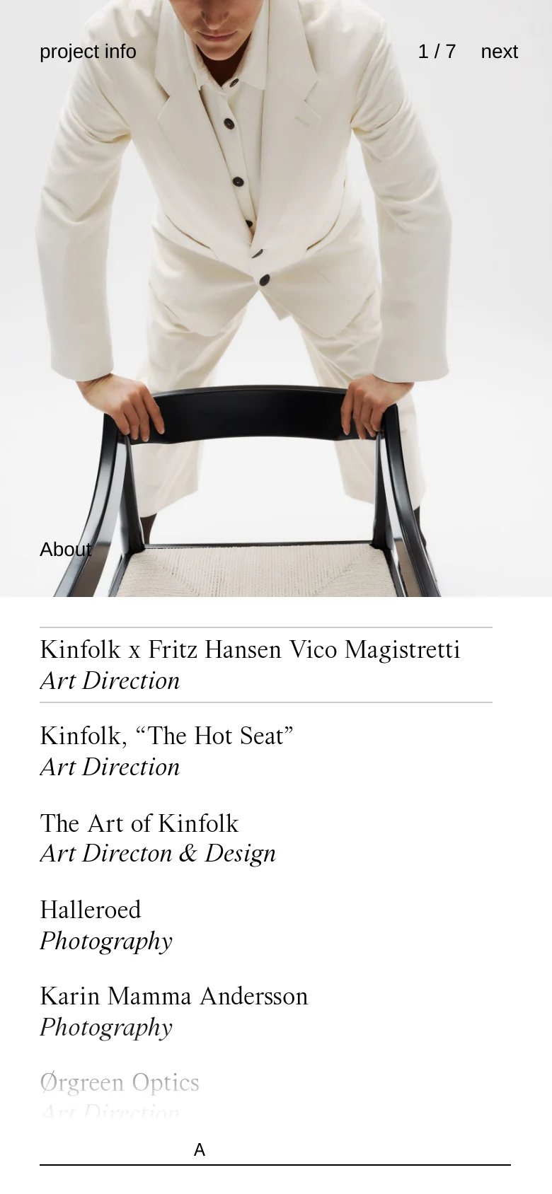The mobile version presents a vertically stacked layout, starting with the hero image of the person in a white suit. Below the image, the project title 'Kinfolk x Fritz Hansen Vico Magistretti' and its role are prominently displayed, followed by a single-column list of other projects. The minimalist aesthetic and high-contrast black and white theme are maintained.