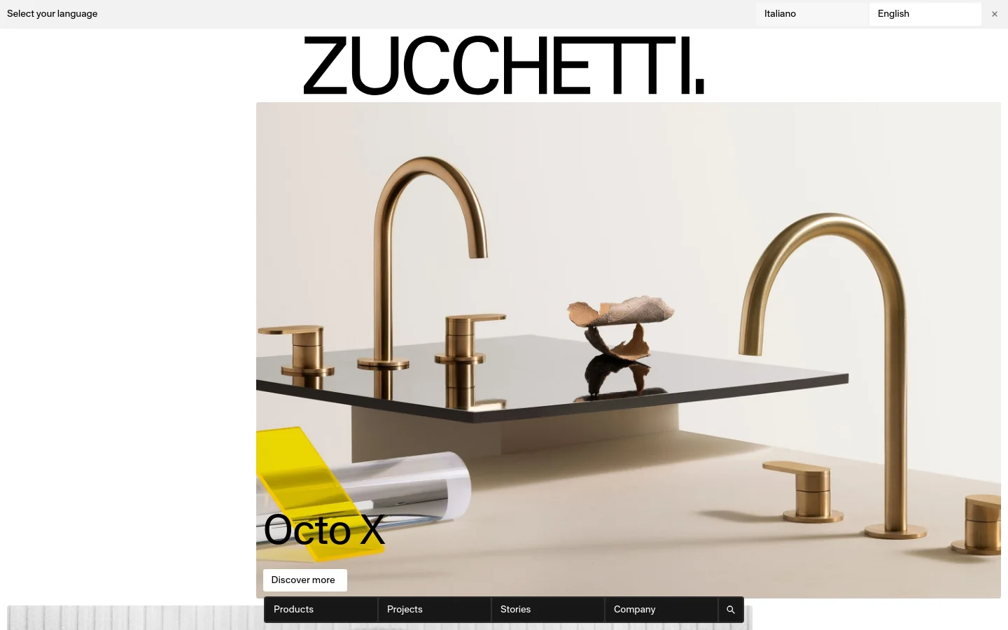 The Zucchetti homepage features a minimalist design with a large hero image of elegant gold bathroom faucets on a black surface. Below the hero section, the layout includes large text headings for collections like Octo X and Veloce, followed by sections for Bar 59, design stories, finishings, and projects. The color palette is neutral with high-contrast black text and occasional bright yellow accents.